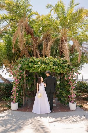 Elopement at the San Diego County Clerks office, couple under arbor in front of the harbor