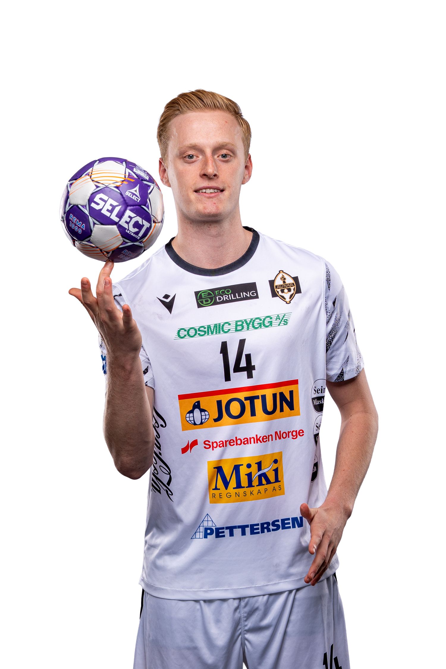 Handball player in white jersey with number 14 and sponsor logos balancing a purple and white ball.