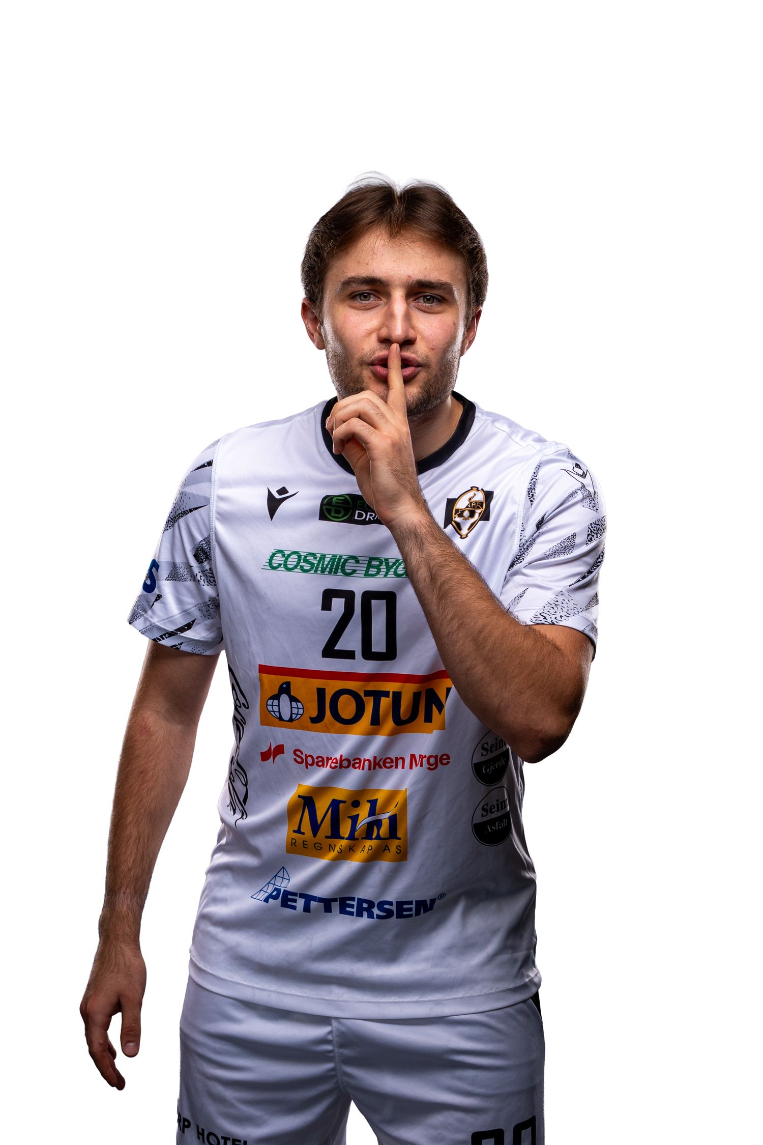 Team members in white uniforms with Jotun sponsorship make playful poses for promotional photos.