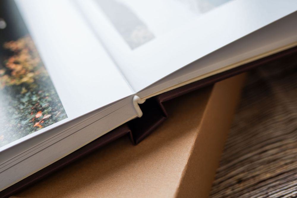 Angled view of an interior wooden window sill with soft natural daylight streaming through the window.