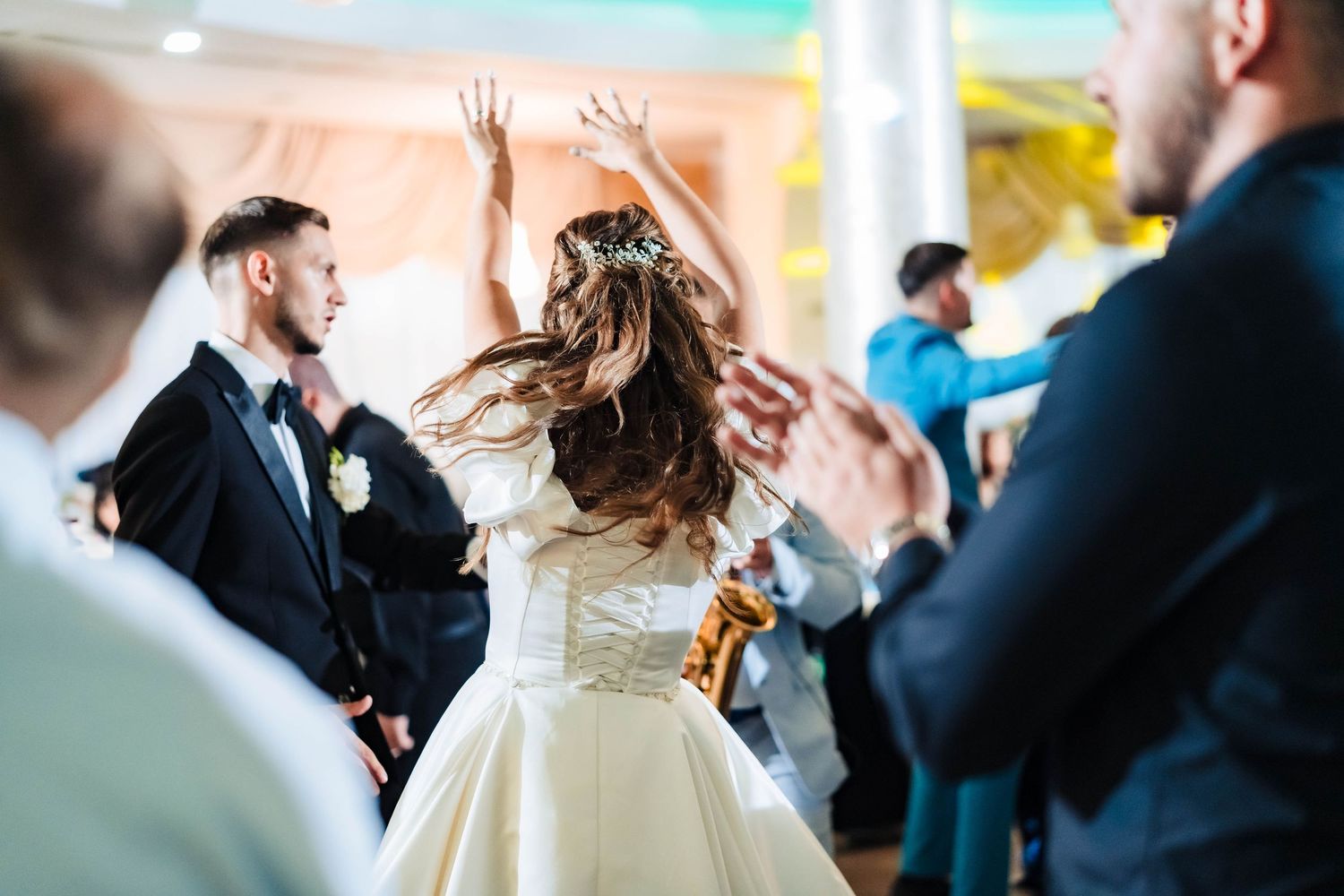 Wedding celebration captured with artistic lighting and festive atmosphere.
