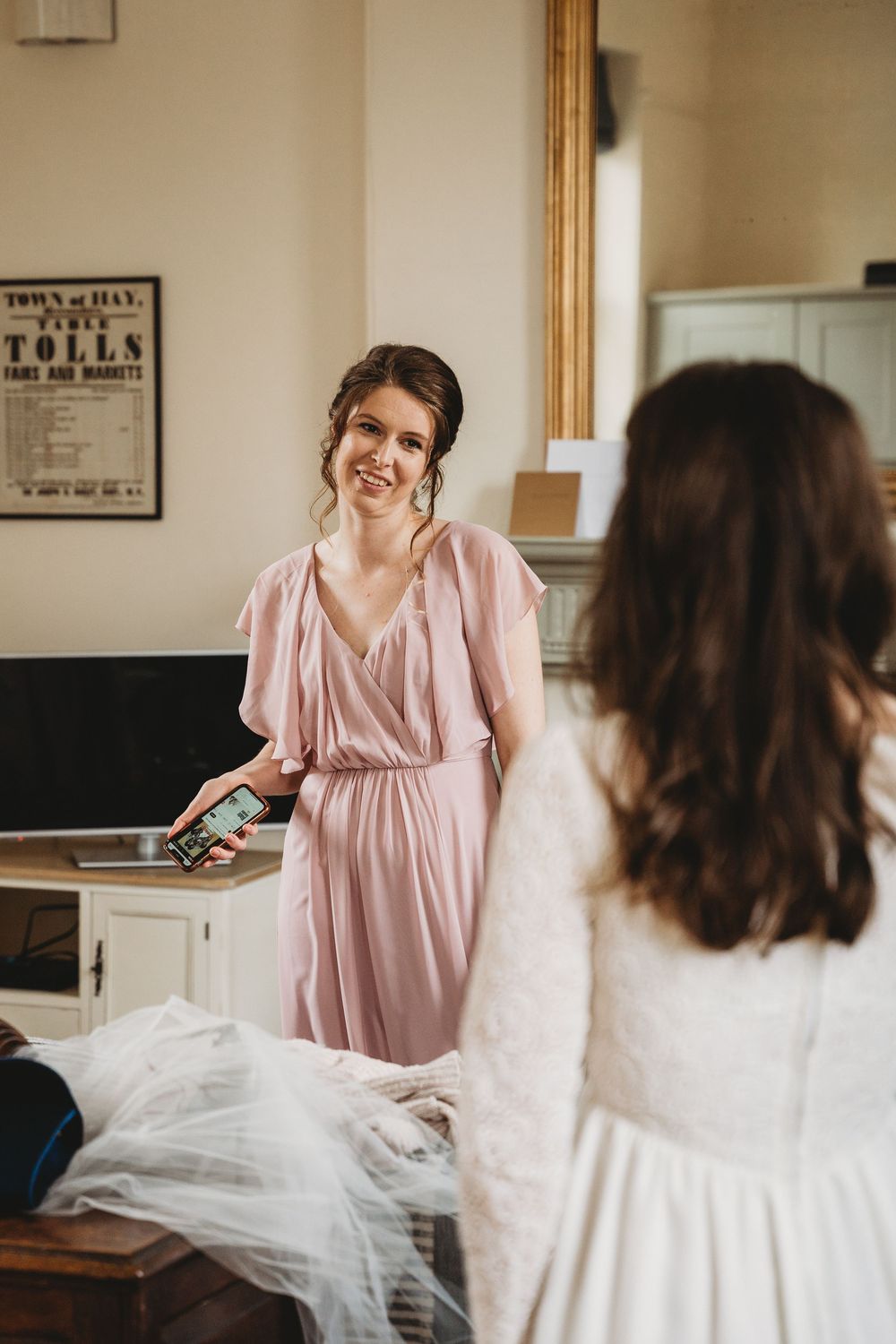 Bridal party sharing joyful moments while preparing for the wedding ceremony.