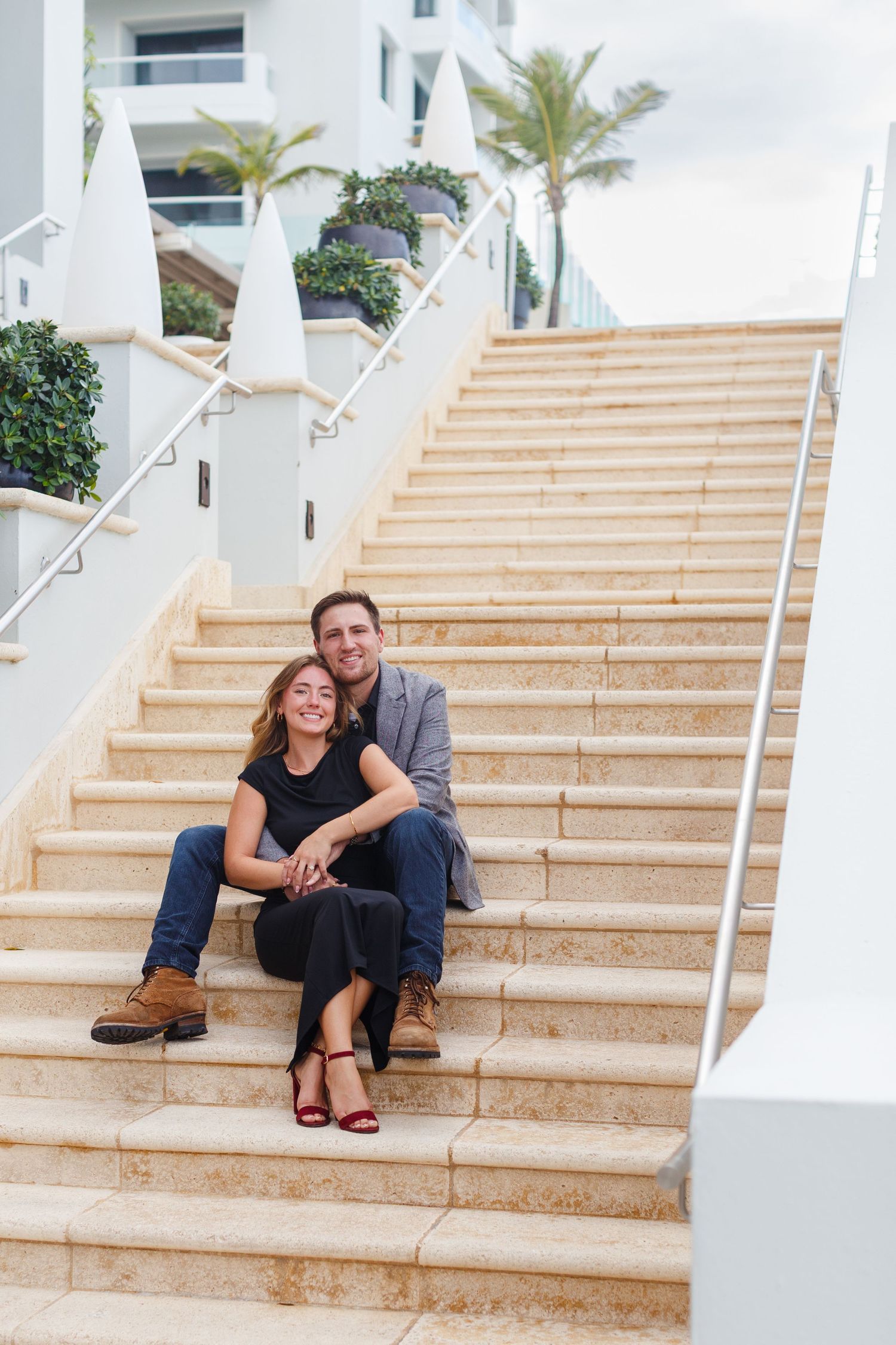 Couples portrait. Seated on stairs at the Condado Vanderbilt Hotel in San Juan, Puerto Rico.