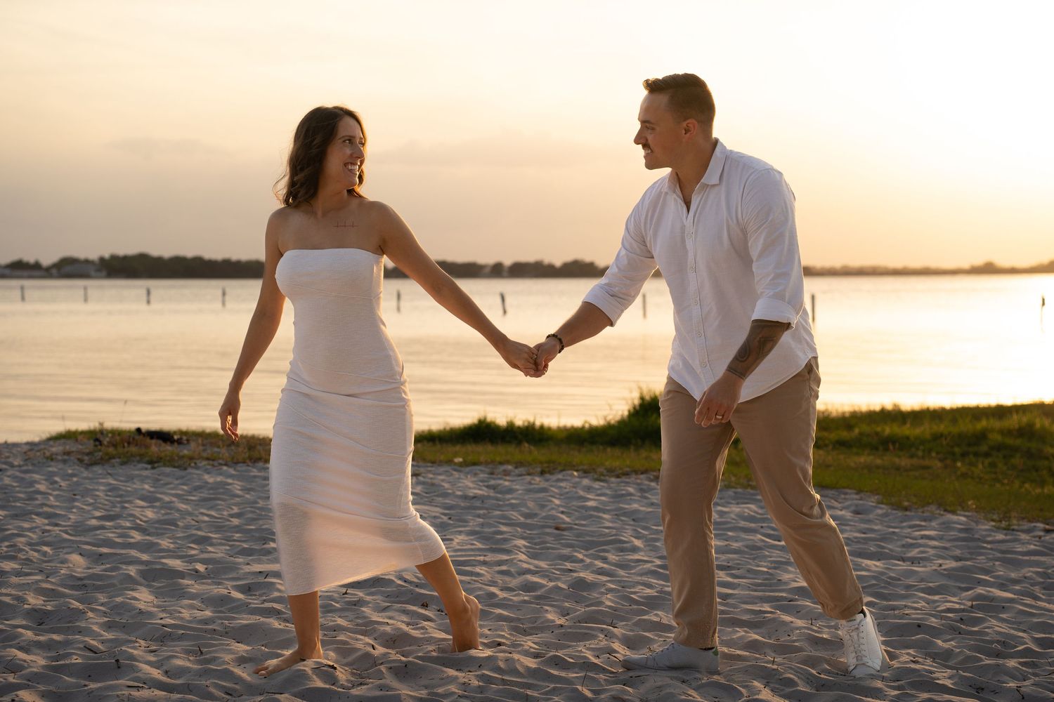 Wedding couple walk on the beach after their ceremony in Clermont FL.