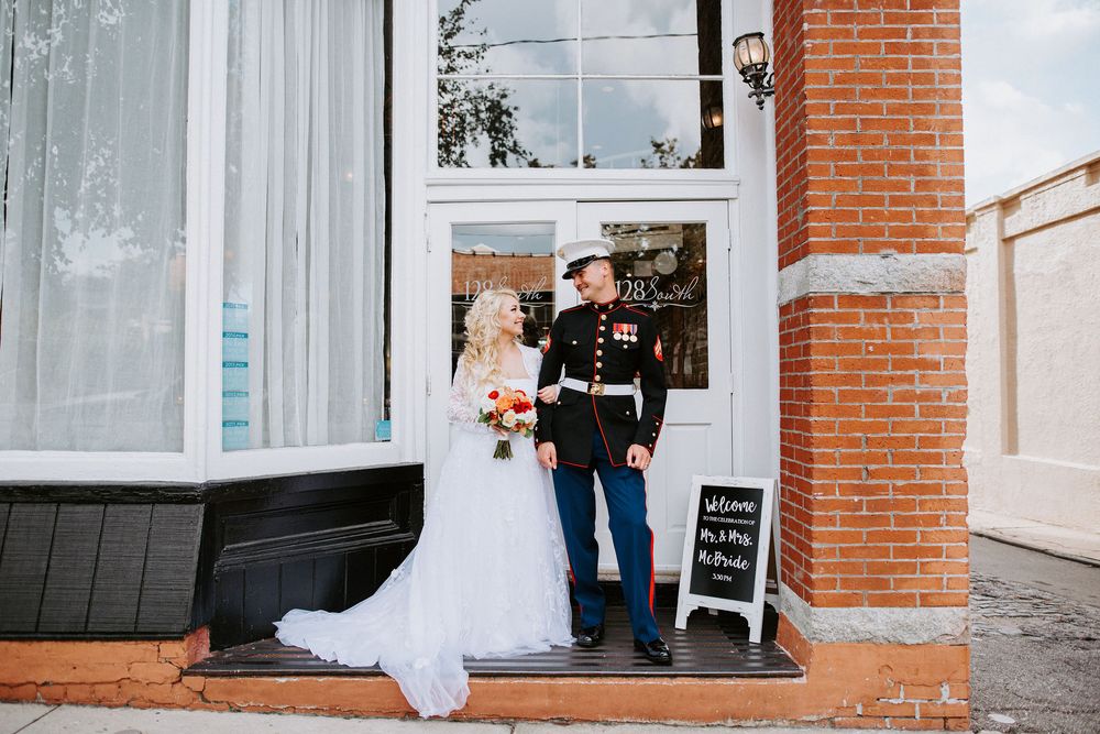 A collection of wedding photos showing details of a white dress and brick building exterior in a romantic setting.