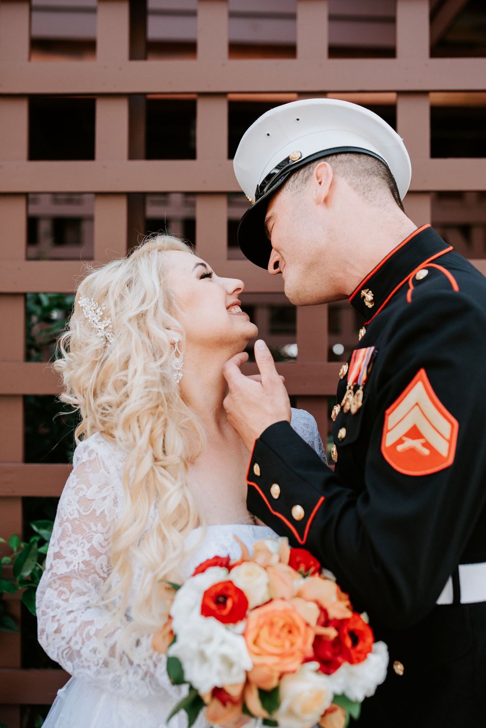 A series of romantic wedding photos showing a couple in military dress and white gown with peach and red floral bouquet.