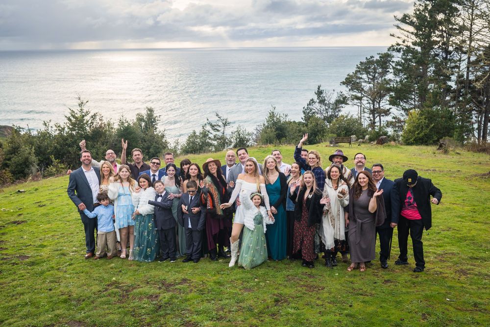 A sequence of group photos taken outdoors against a scenic coastal backdrop with green grass and cloudy skies.