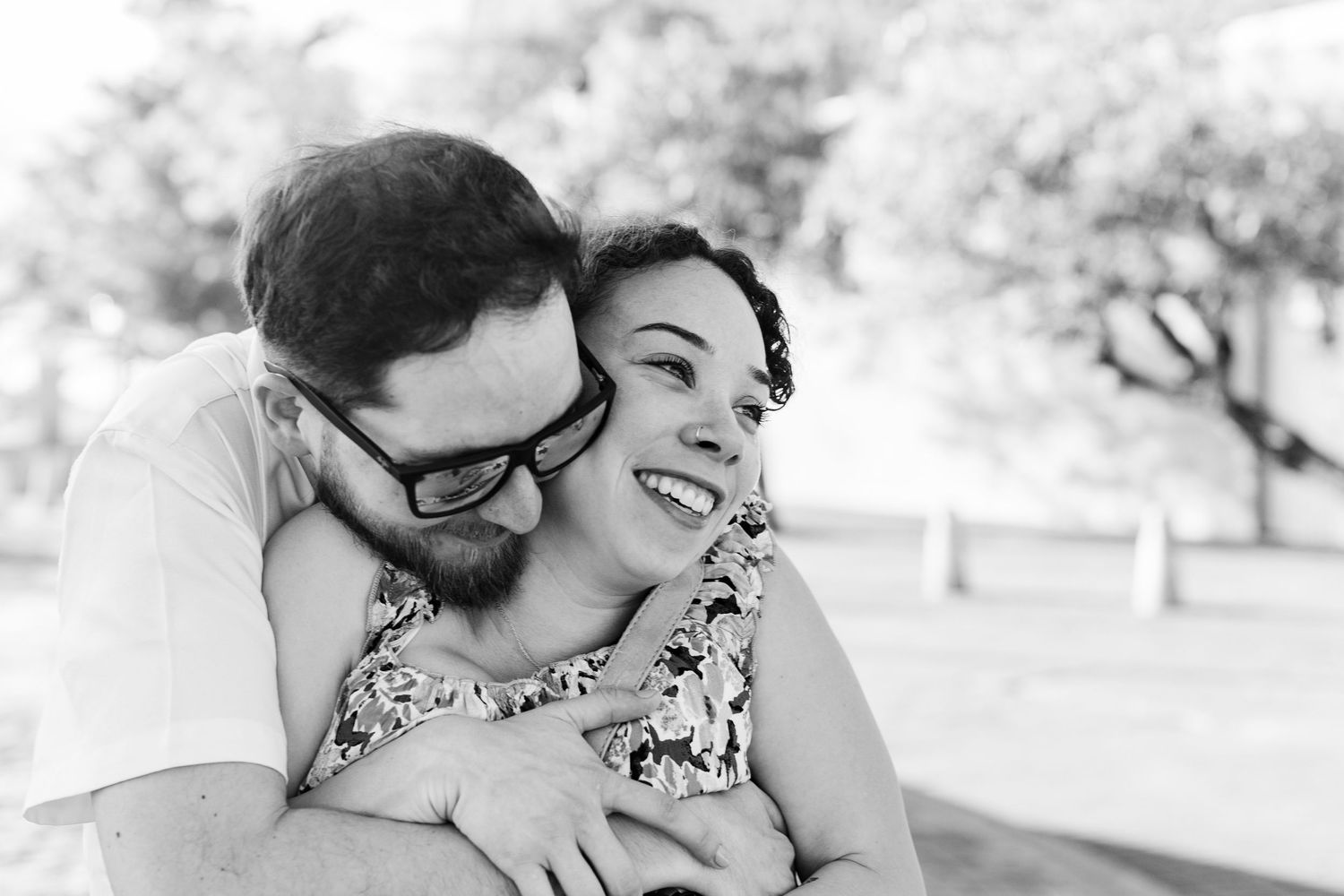 Couples portrait. Black and white image. Marriage proposal at Fuente Raíces in Old San Juan, Puerto Rico.