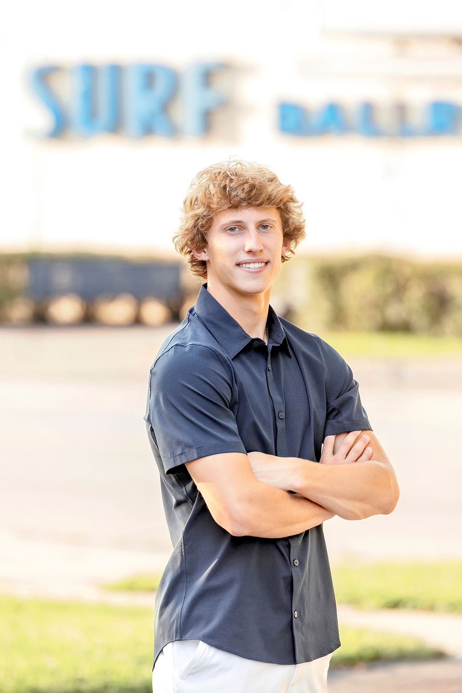 High school senior boy portrait in front of the Surf Ballroom sign in Clear Lake Iowa
