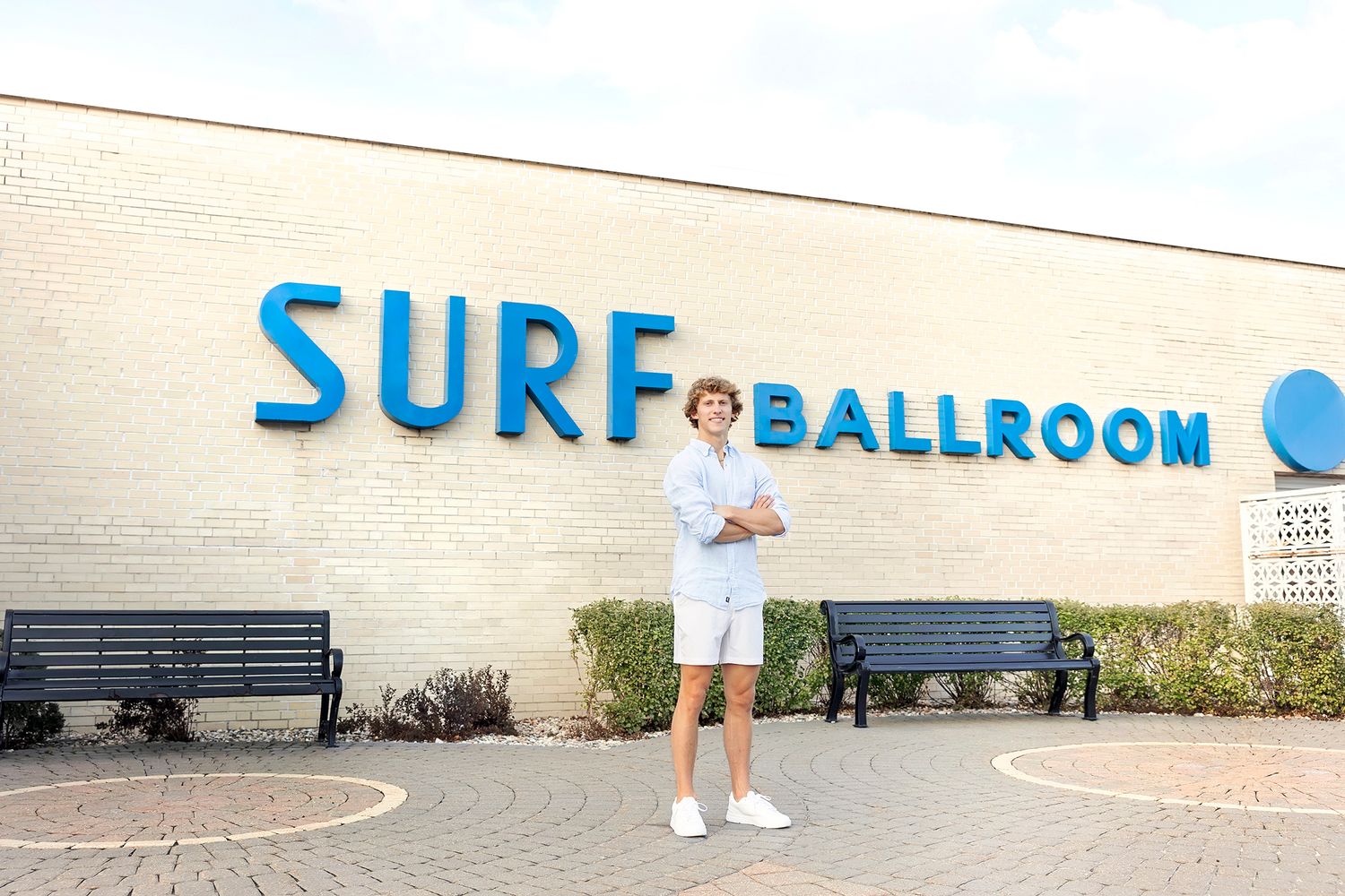 Senior boy standing in front of the famous Surf Ballroom in Clear Lake Iowa
