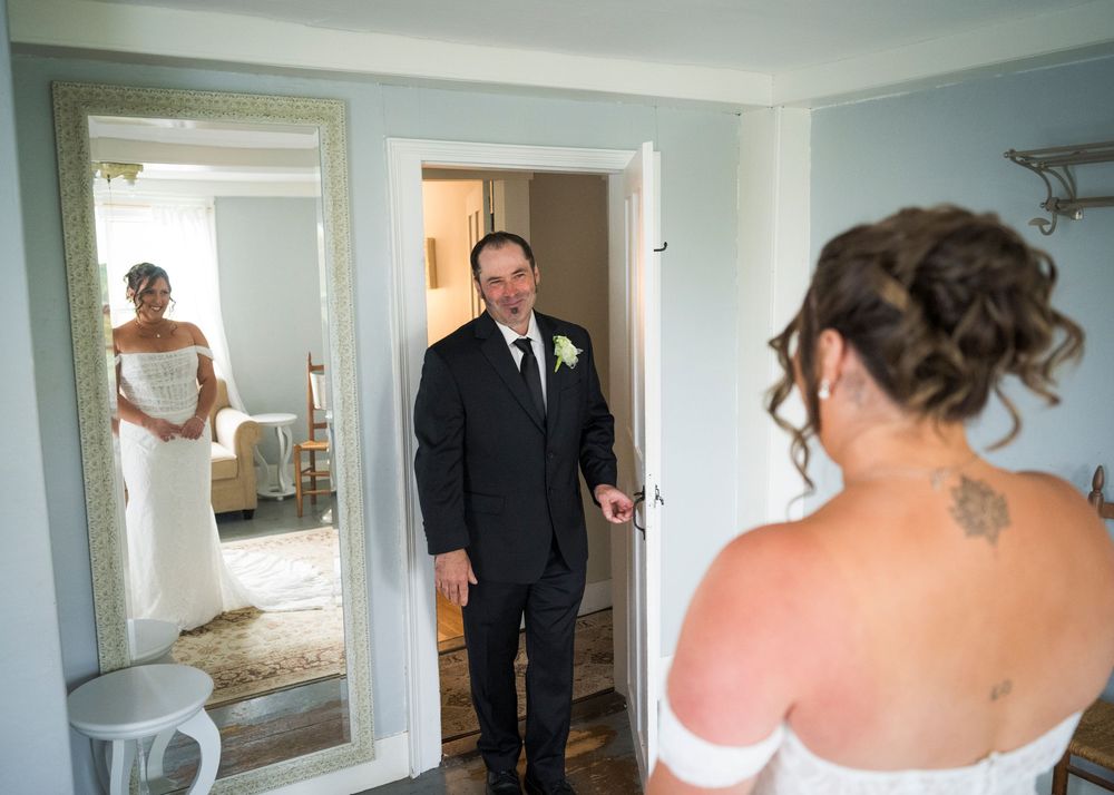 Groom sees bride for the first time during emotional wedding day first look.