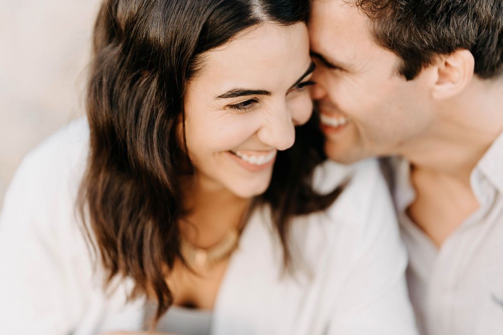 A romantic series of candid black and white close-up shots showing a couple sharing tender moments together.