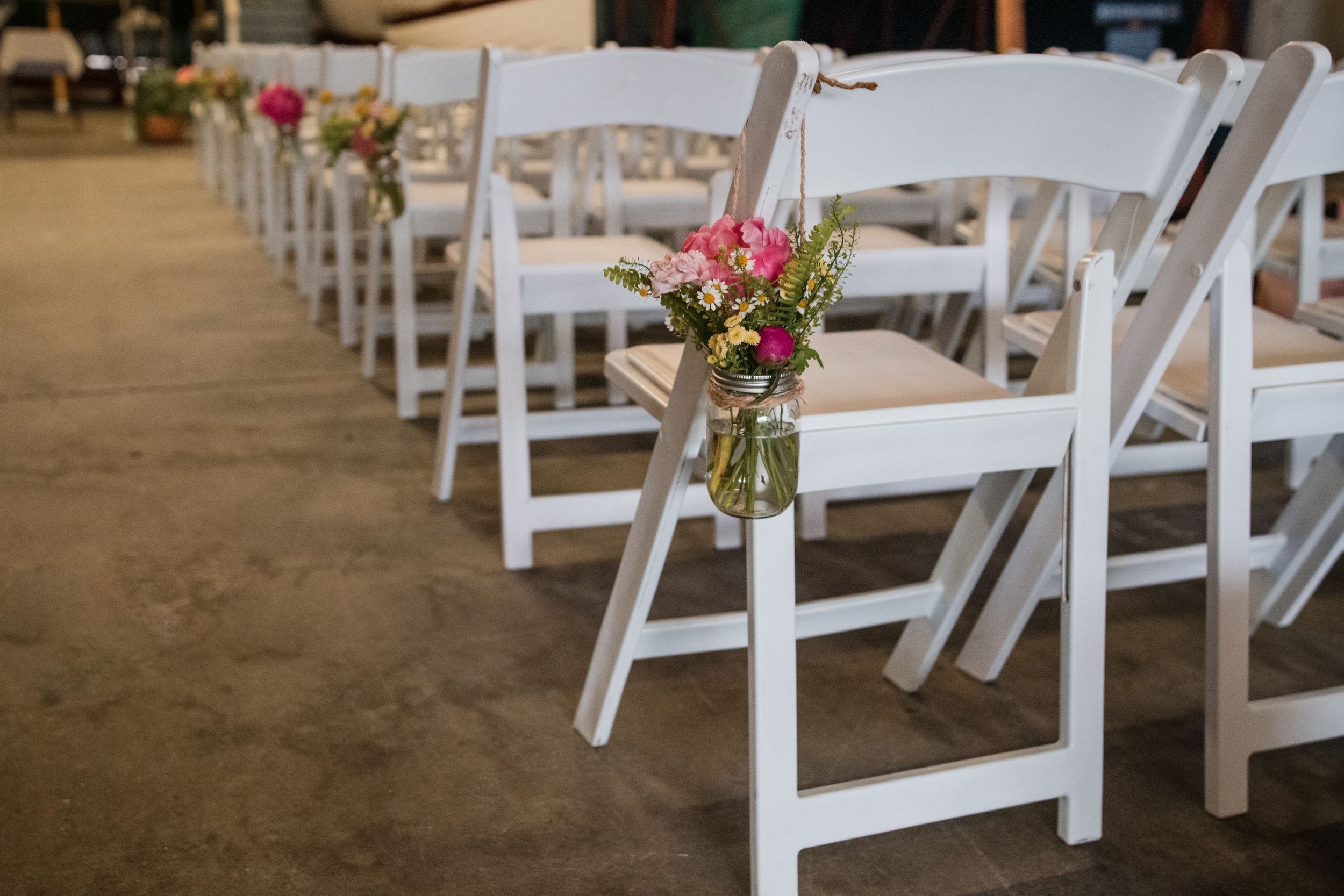 Sunset wedding on the pier at Herreshoff Marine Museum. Luxury waterfront photography in Bristol, RI by local expert Stefy Hilmer.