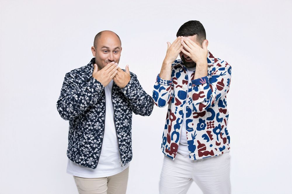 A series of photos showing someone wearing a blue and white floral print shirt against a white background.