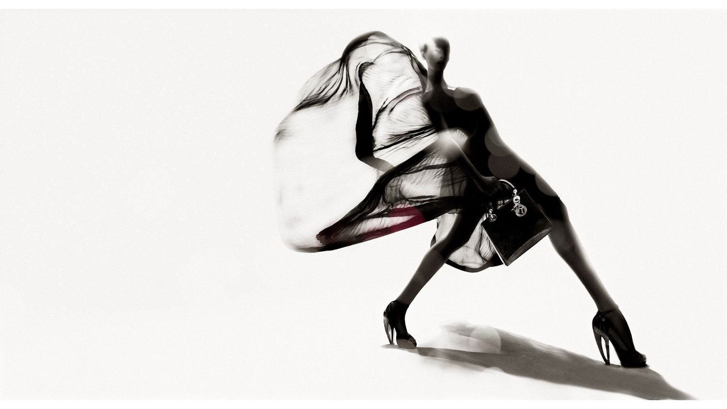 A series of black and white artistic portraits showing intimate poses and expressions in dramatic lighting.