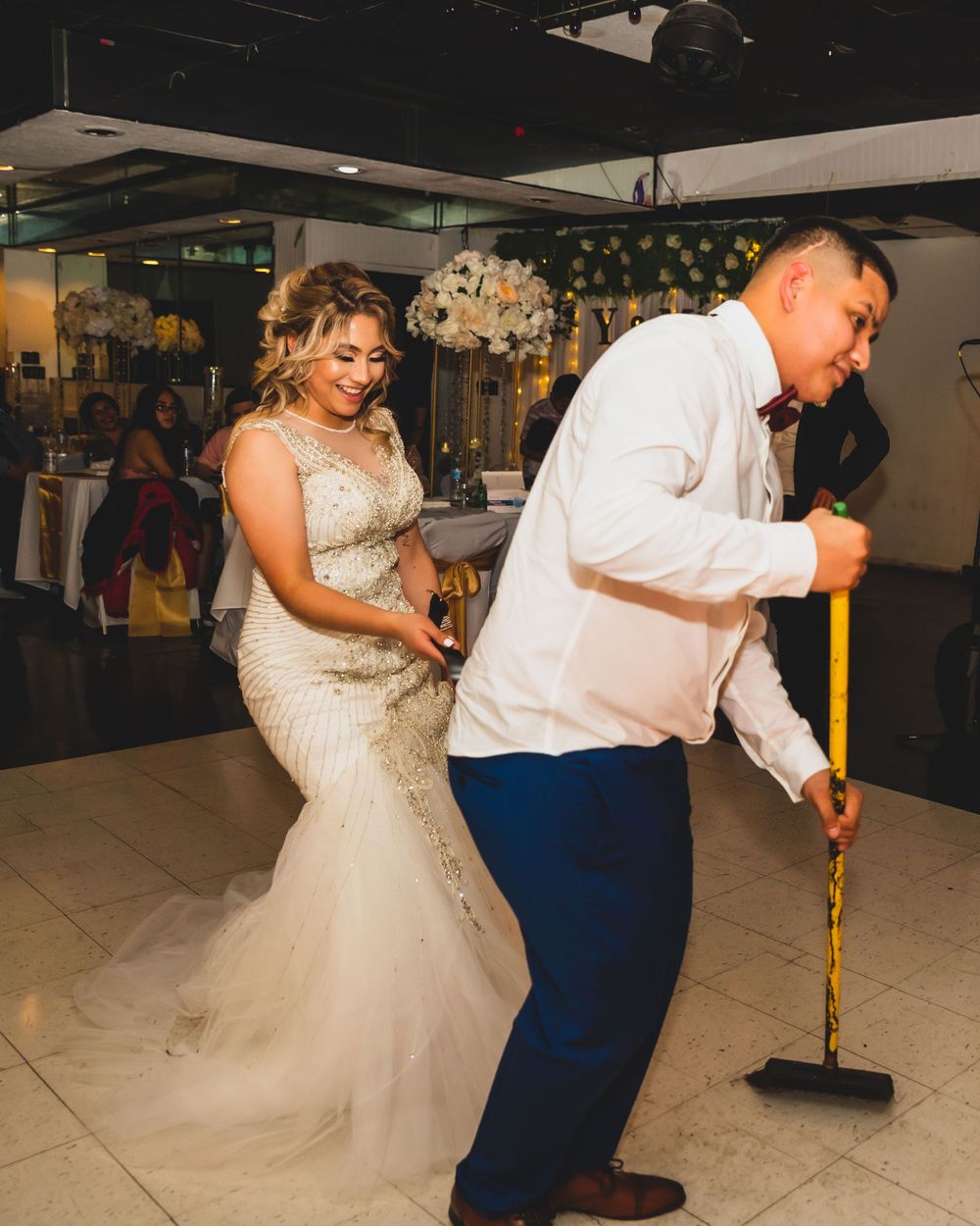 A couple shares a playful moment on the dance floor at a wedding reception, taken by Albany Capture - chicagoland wedding photographer.