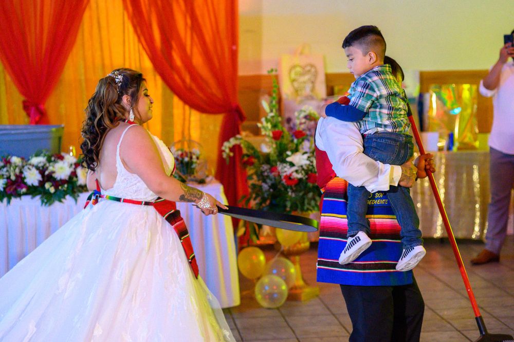Joyful wedding celebration with dancers in formal attire, taken by Albany Capture - Mexican wedding photographers Chicago.