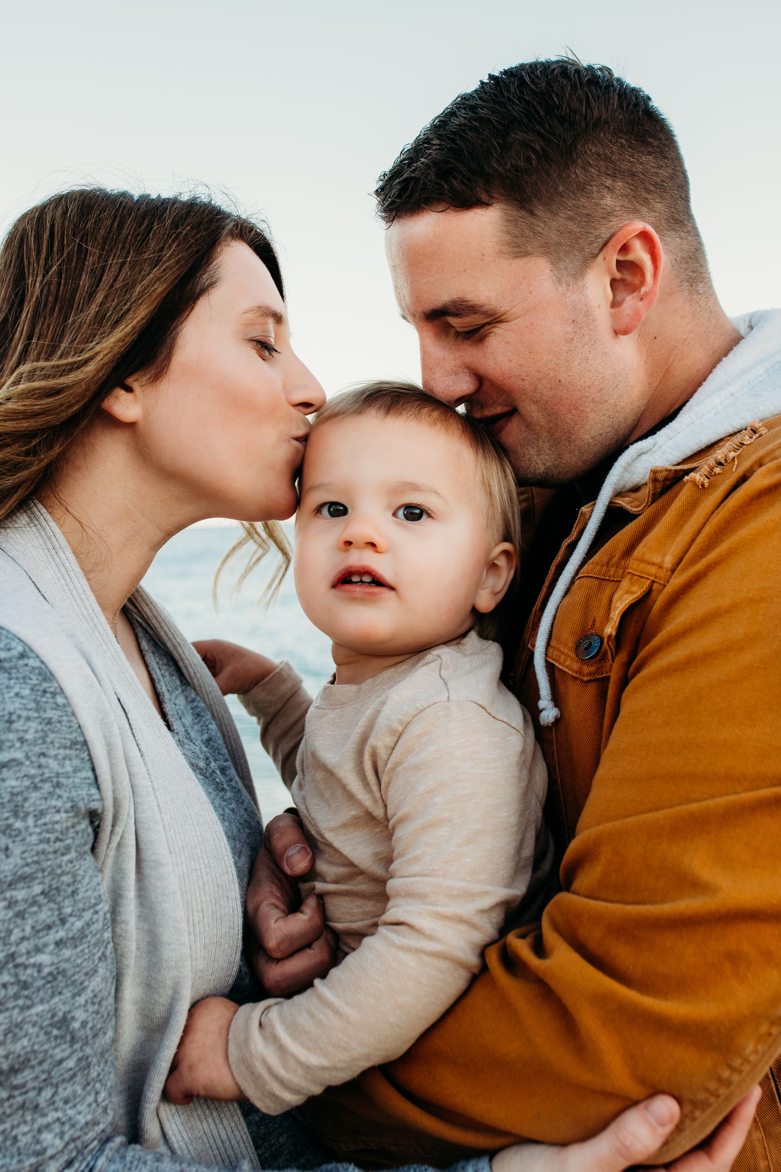Family on beach for family portraits captured by Maryland family photographer Mallory Bramlett,