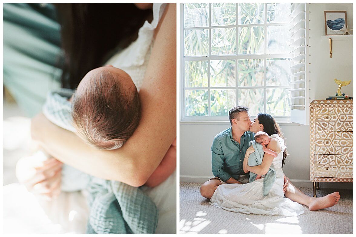 A tender family moment captured in soft light by a window with white decor.