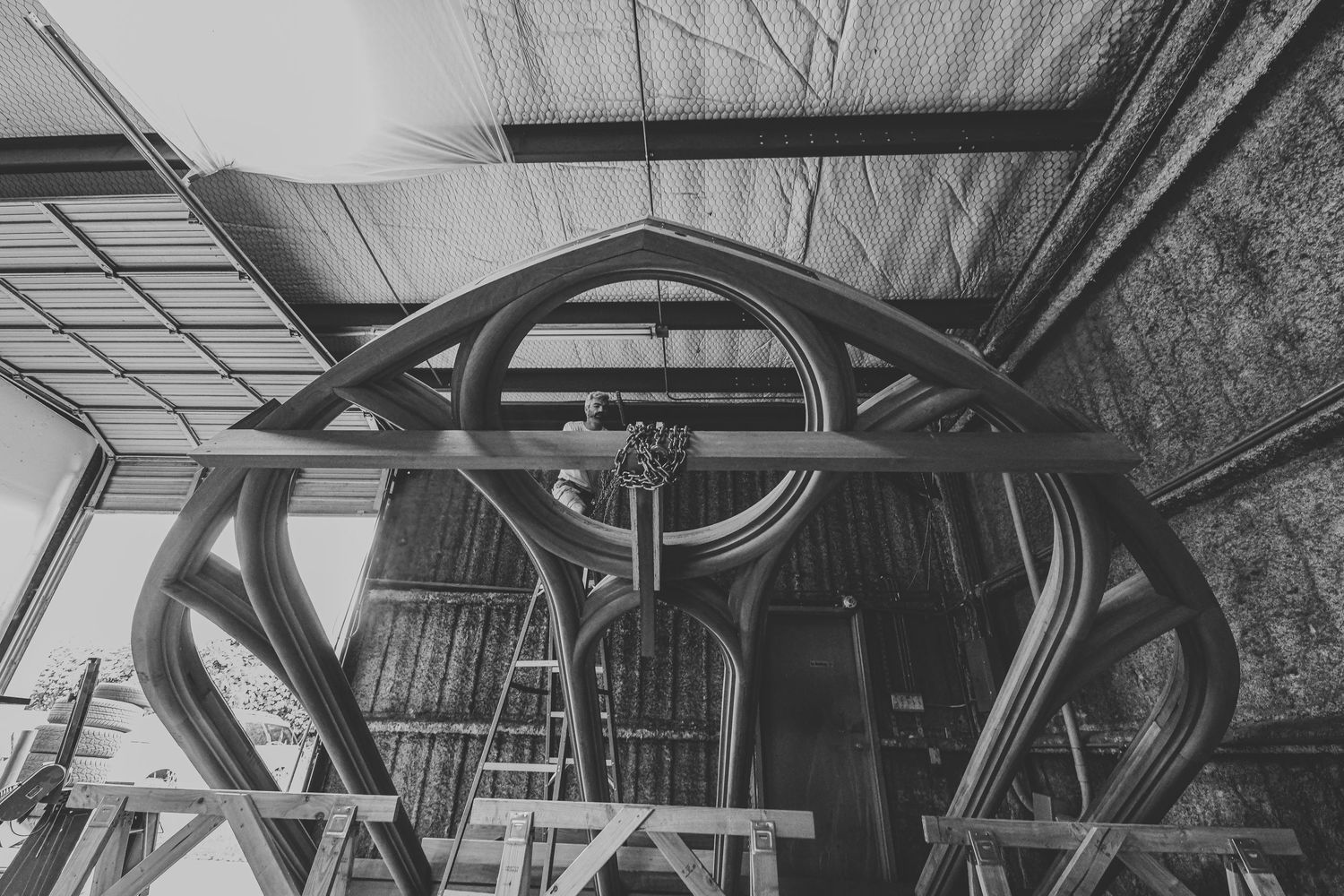Industrial machinery mechanism photographed in black and white showing geometric patterns.
