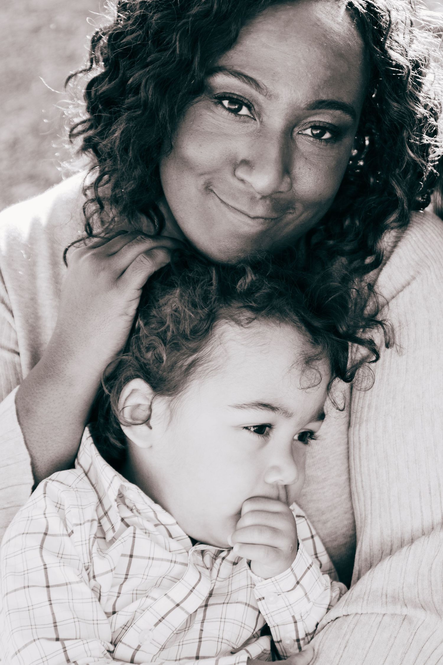 Tender black and white portrait capturing intimate family moment.