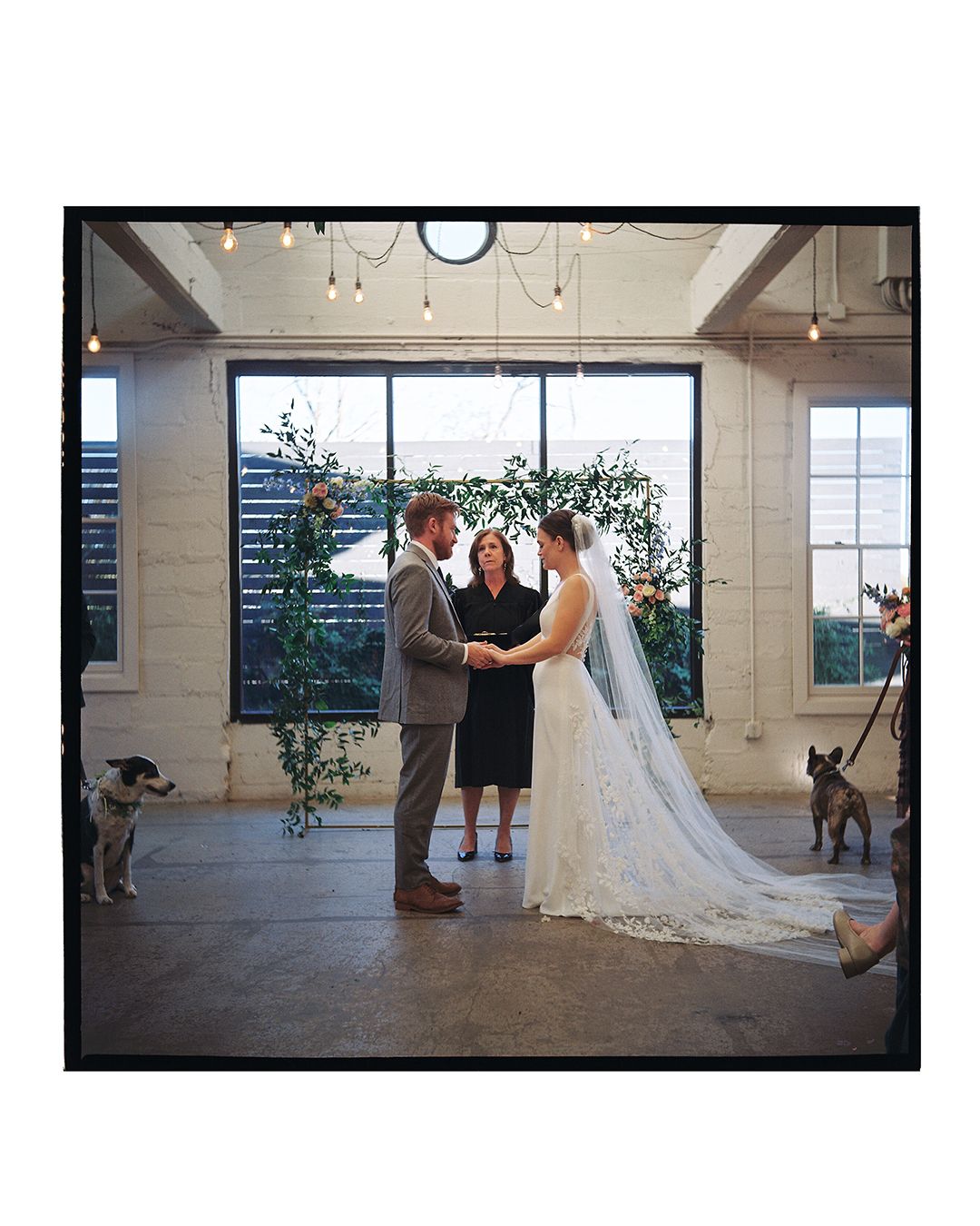 Panoramic shots of a wedding ceremony in a bright industrial space with floral arch decorations.