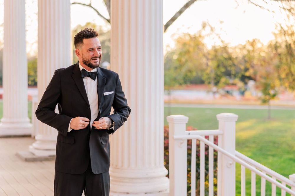 Wedding fashion details showcasing formal attire against classic white columns.