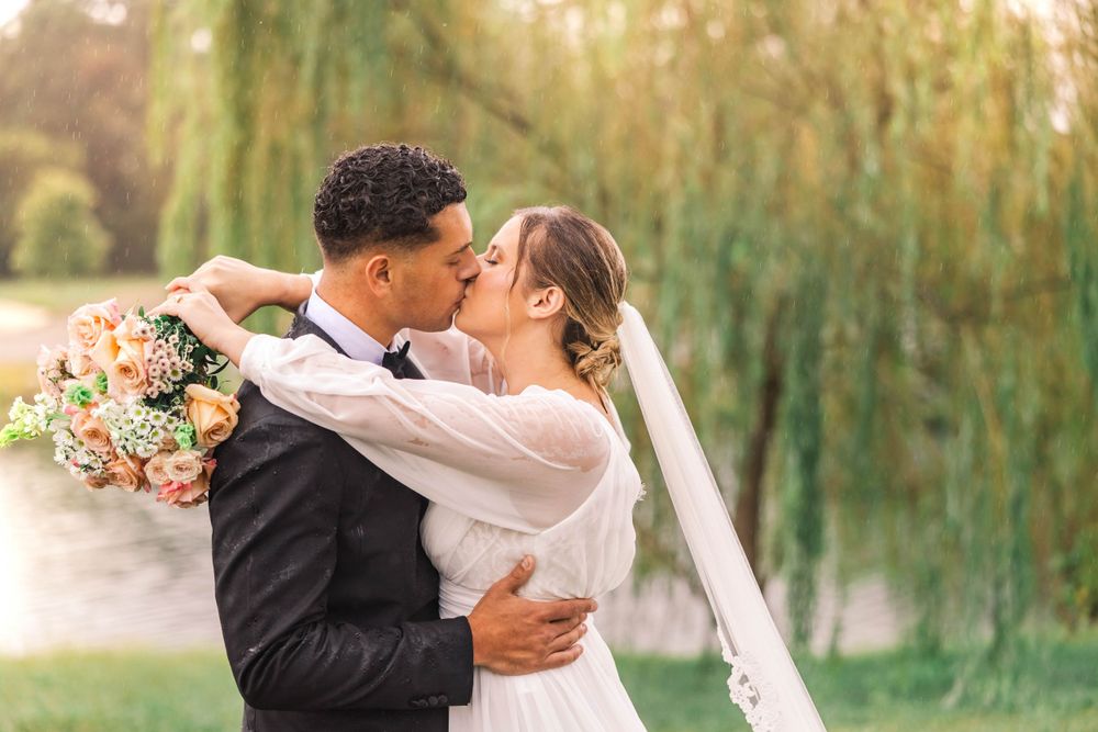 Romantic wedding portraits captured against a backdrop of weeping willow trees.