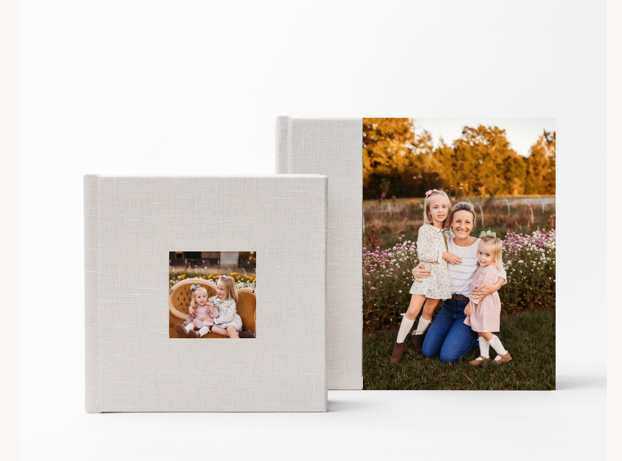 A series of small photo prints and albums arranged in a row on a white surface showing outdoor portraits and memories.