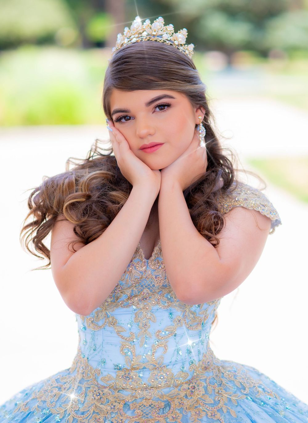 Elegant portrait session in a light blue princess gown with sparkling tiara.
