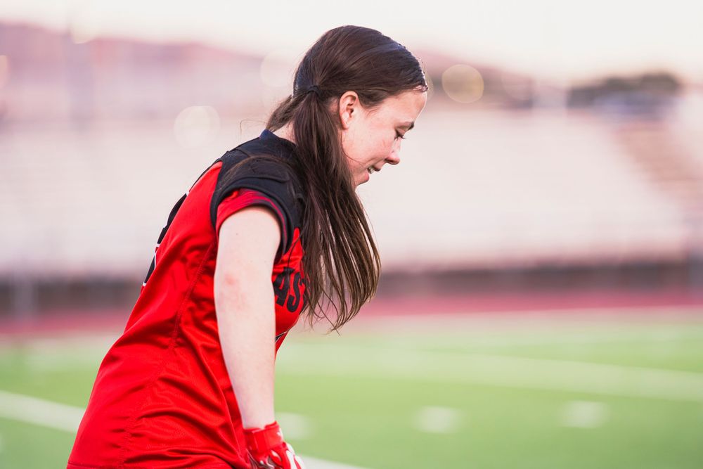 Girls flag football player focused during a drill