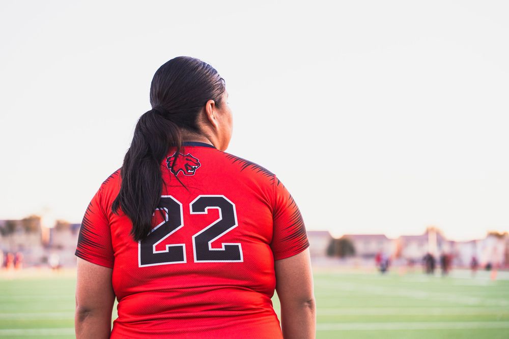 Girls flag football player looking off right