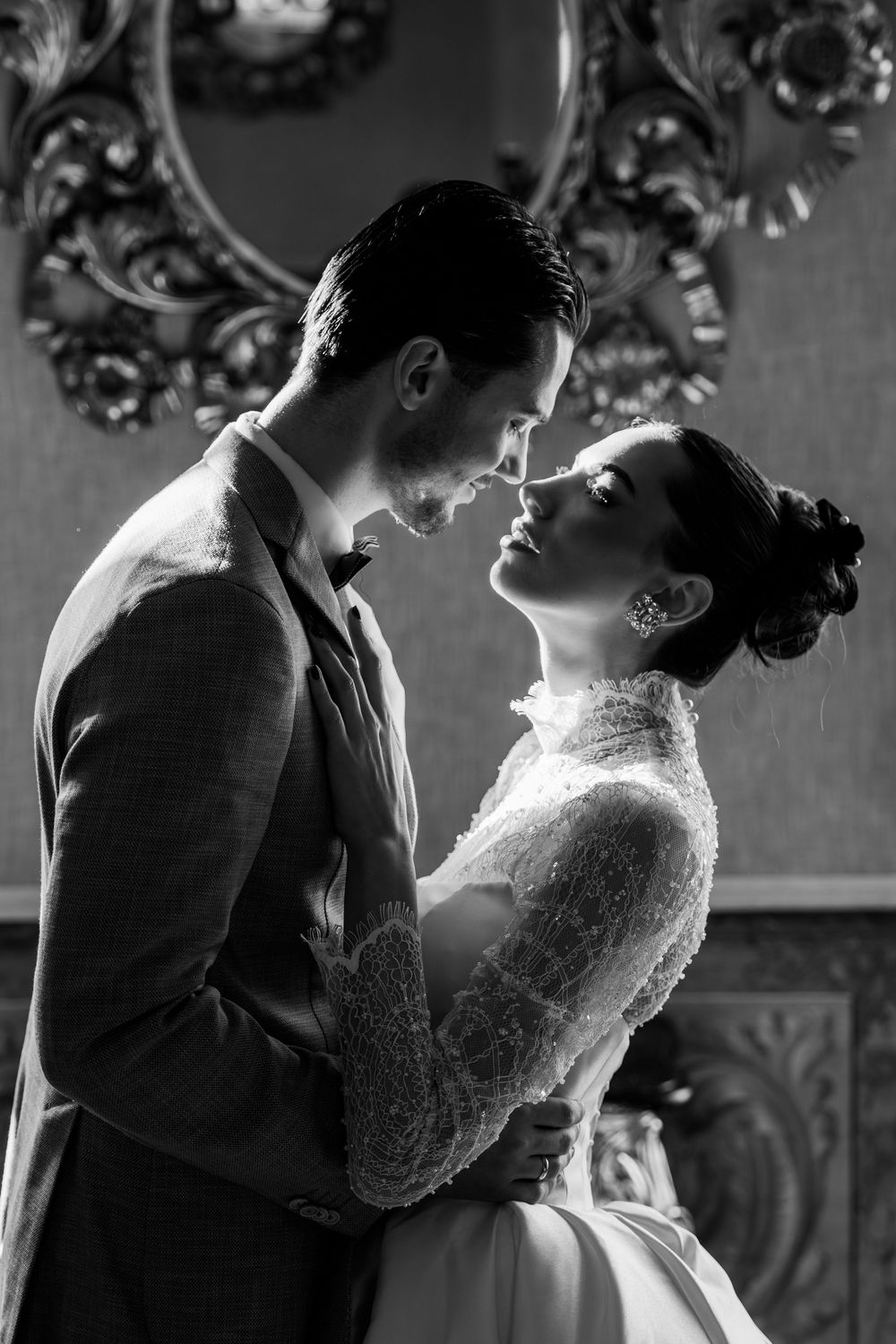 A romantic black and white photo sequence shows a couple in wedding attire sharing intimate moments together.