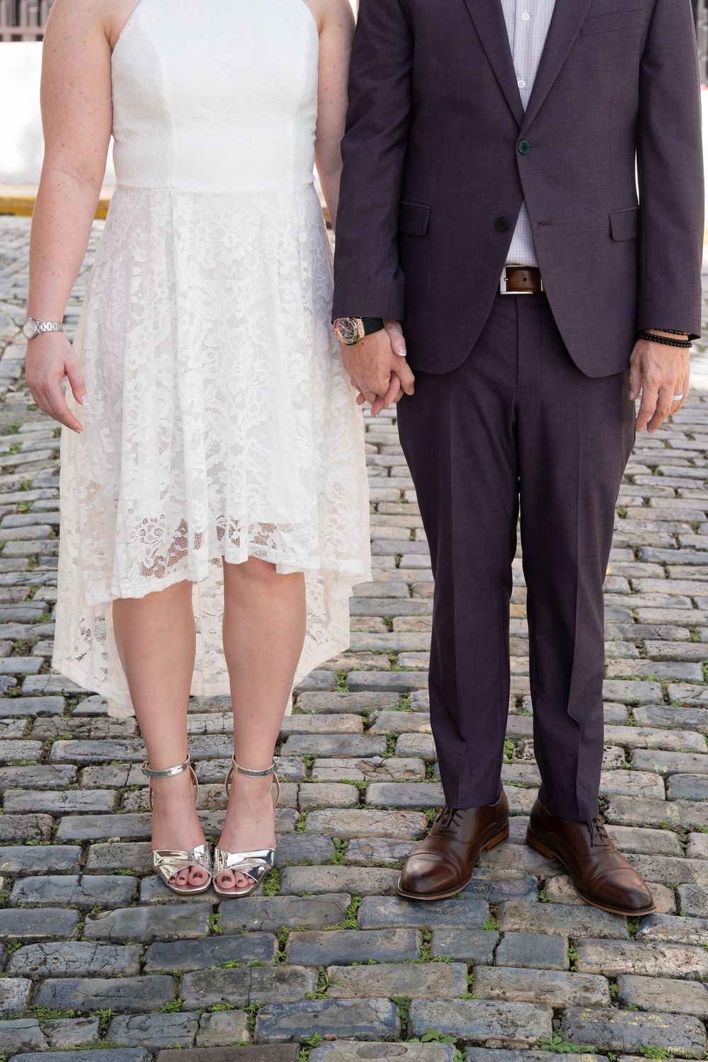 Luxury editorial engagement session in Old San Juan Puerto Rico featuring stylish couple walking through cobblestone streets.