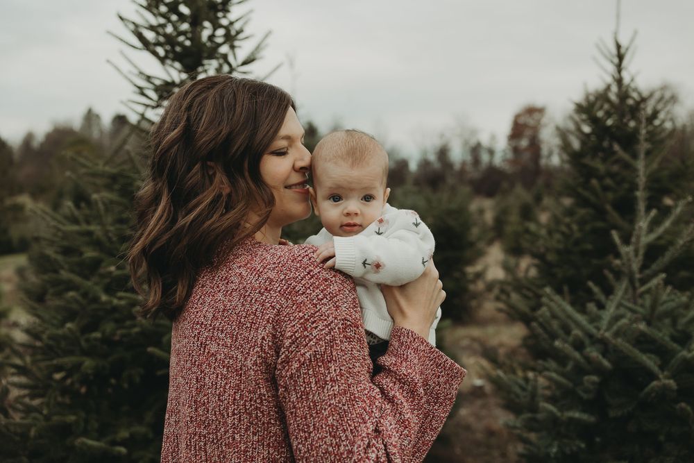 A series of candid moments captured at a Christmas tree farm on an autumn day.