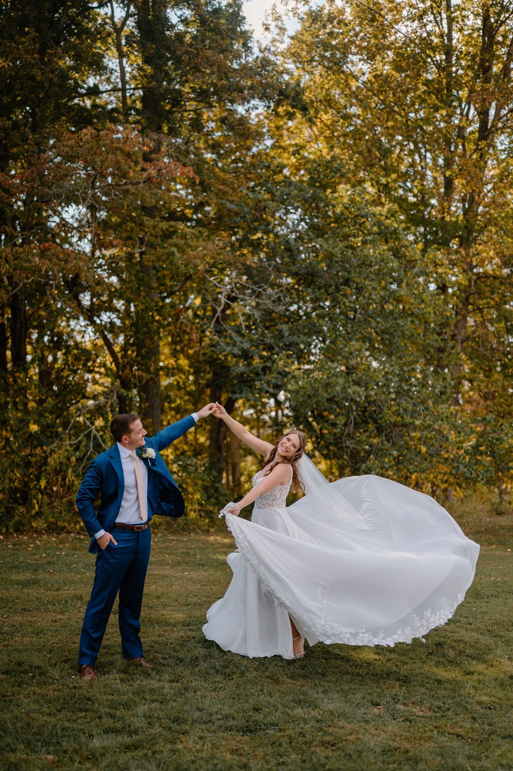 Bride and groom walking through wooded paths at Cincinnati Nature Center