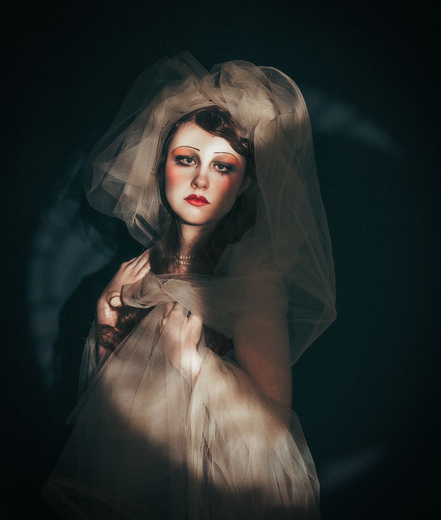 Artistic black and white photo series showing a woman in dramatic shadows with closed eyes and floral hair accessories.