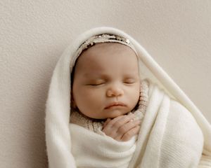 Natural newborn photography capturing baby's earliest days