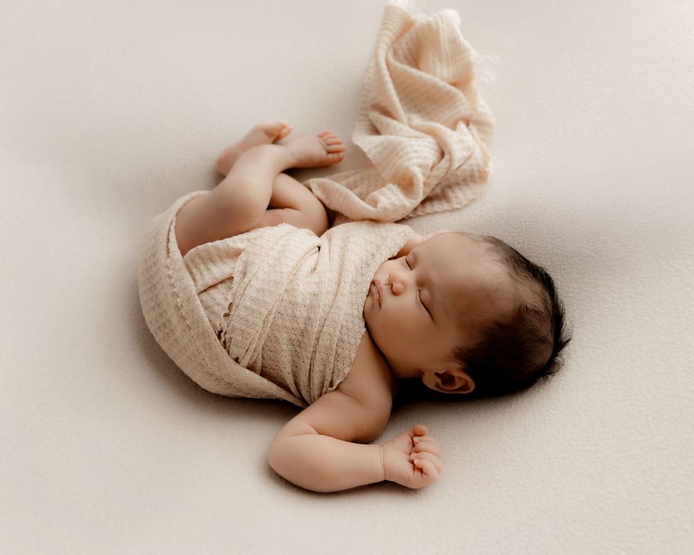 Newborn baby sleeping during studio photography session