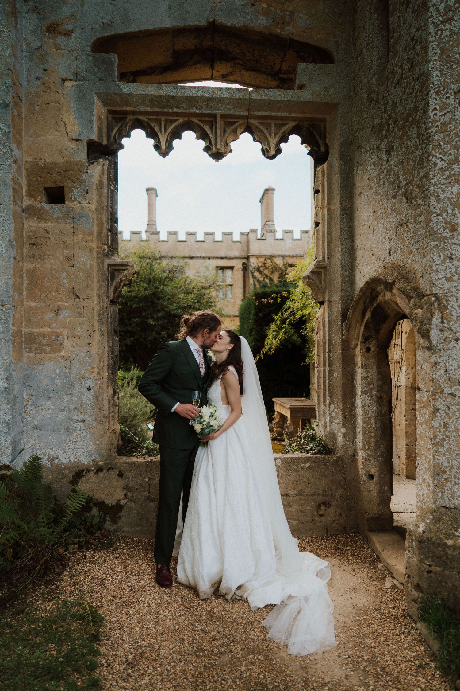 Newlyweds sharing a quiet moment at Sudeley Castle, Cotswolds