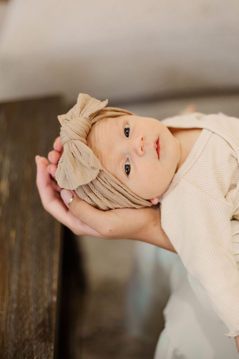 A series of close-up profile shots showing a small child with light hair lying down against a neutral background.