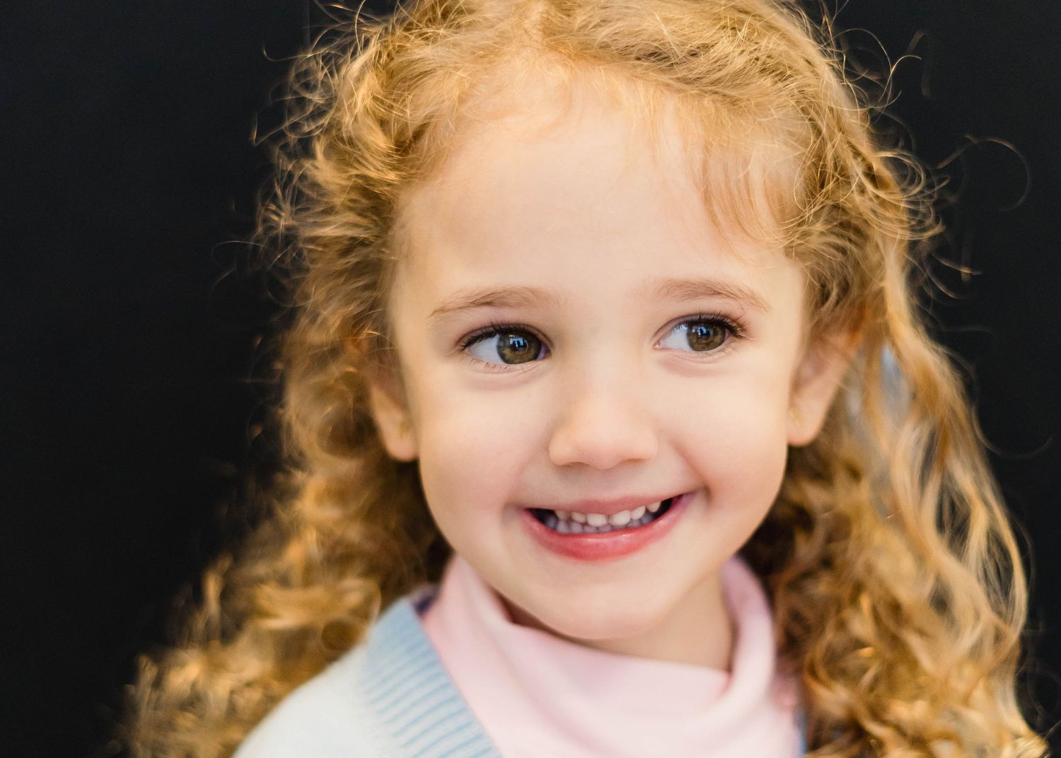 Laughing girl in outdoor play area captured by Space Coast photographer Aliza.