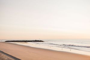 Bradley Beach sunrise during a surf inspired engagement shoot. Coastal jersey wedding photographer. East Coast wedding photographer.