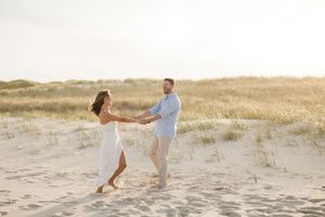 Golden hour engagement portraits at Island Beach State Park in New Jersey. Coastal New Jersey Wedding Photographer.