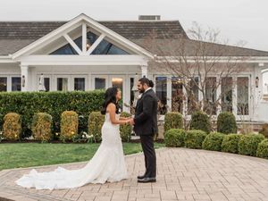 First look between a couple during a wedding at Crystal Point Yacht Club, in Point Pleasant, NJ. East Coast Wedding Photographer.