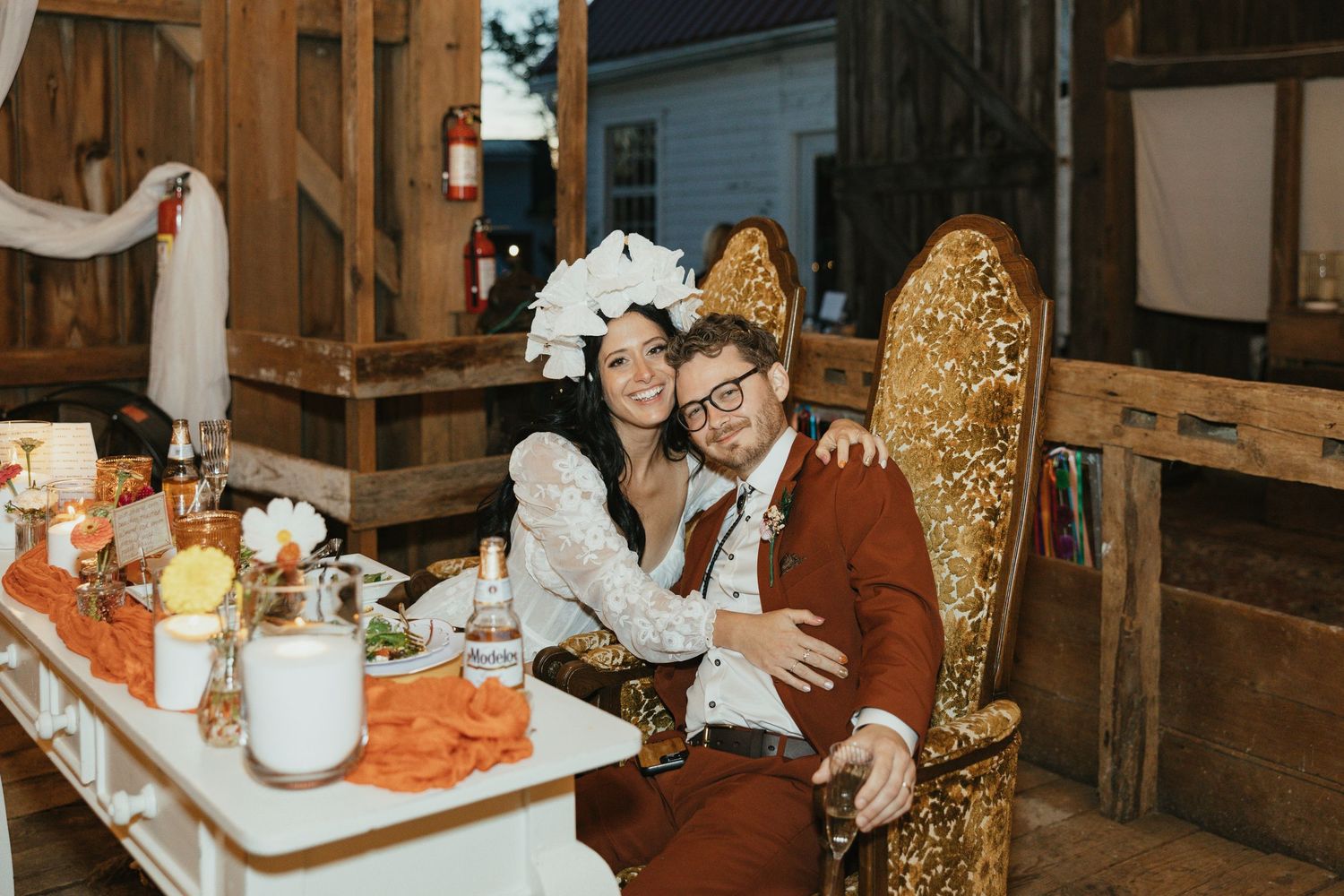 Two people sharing a candid, joyful black and white moment together with genuine laughter.