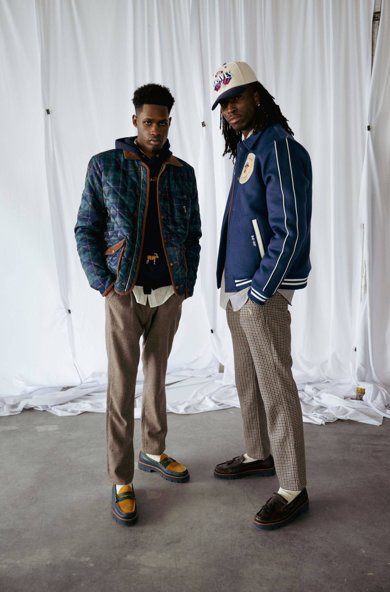 Two male models posing backstage at Atlanta fashion week.