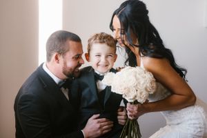 Intimate family moment captured during wedding celebrations.