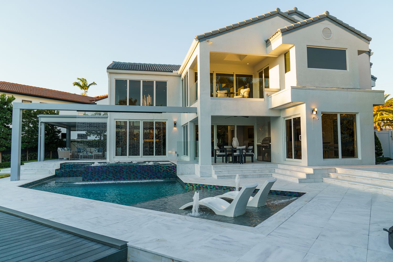 Bright exterior of a South Florida home with wide-angle view and natural light, professional real estate listing photo by SRX Media