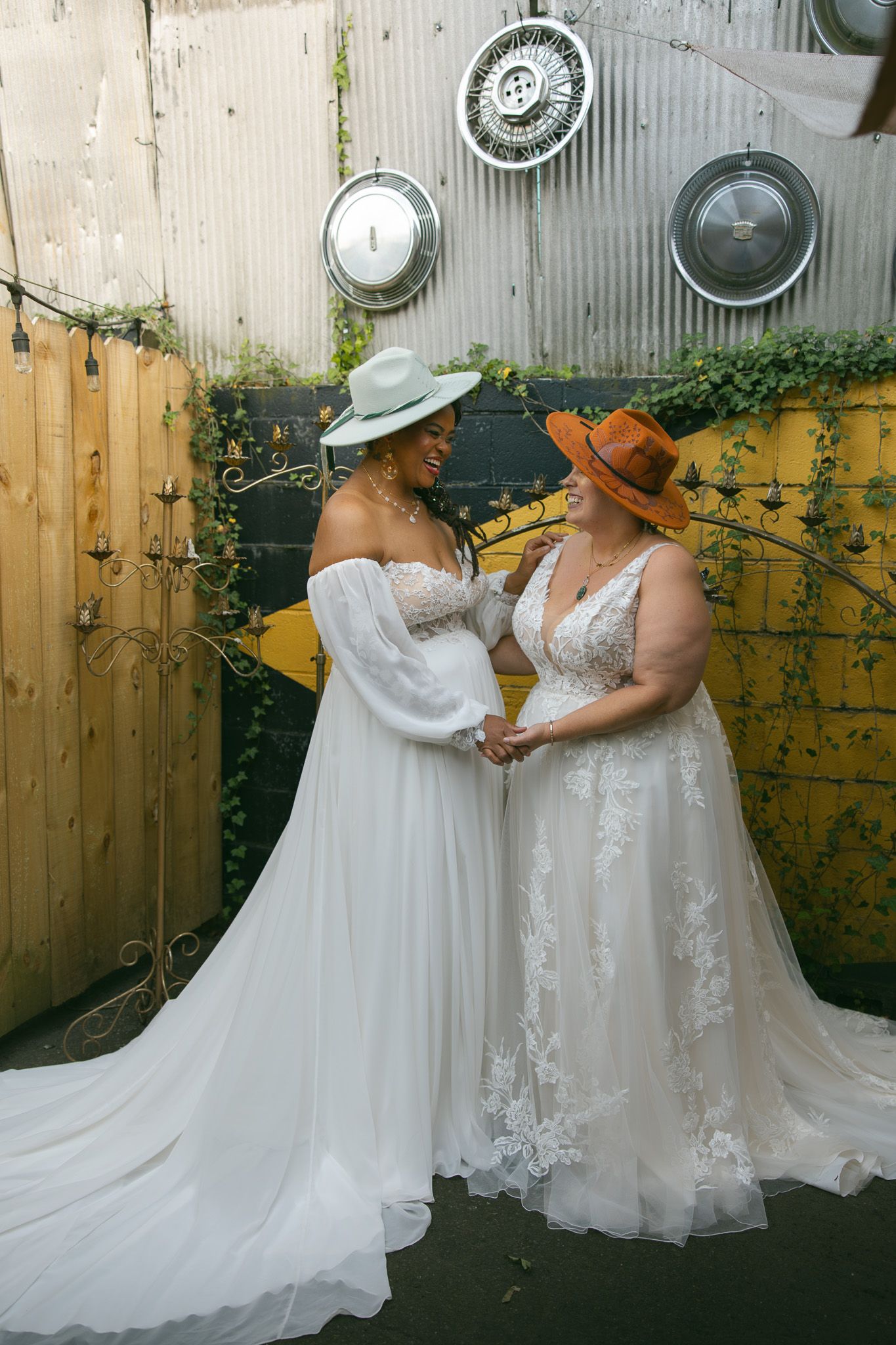 romantic queer lgbtq couple vintage dive bar mural fleetwoods asheville NC elopement wedding day brides adventure